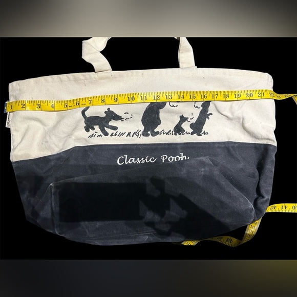 Disney Winnie the Pooh tote bag. Well loved. Some wear discoloration. Zip close. - Picture 3 of 13